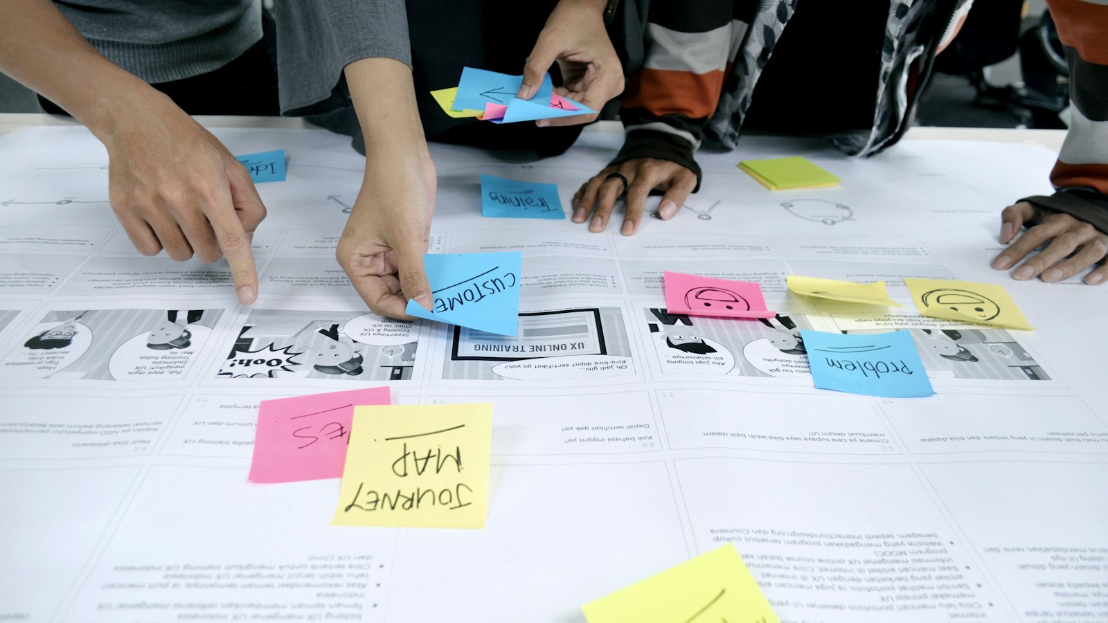 team collaborating with sticky notes